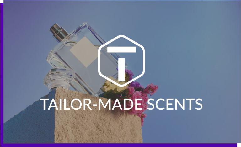 Elegant perfume bottle with colorful flowers and Tailor-Made Scents logo
