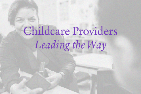 Smiling childcare provider engaging with a child, representing small business leadership in early education